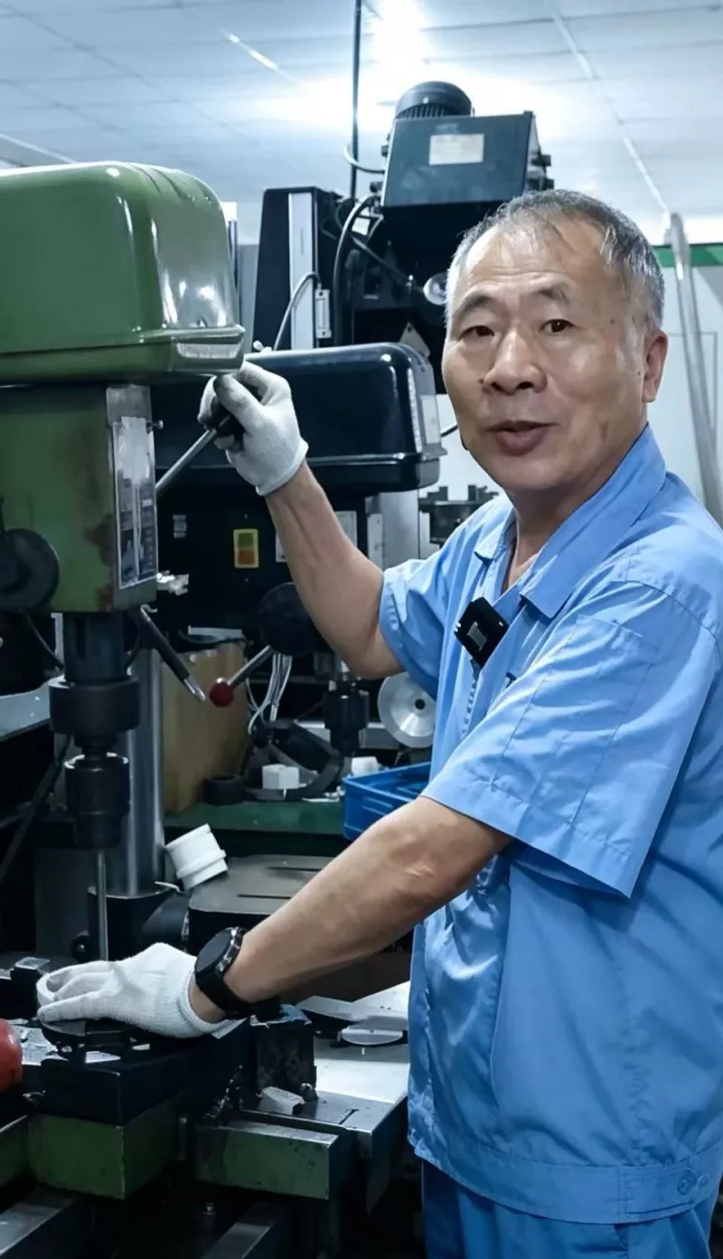 A Taifno technician focuses on machining work in our workshop